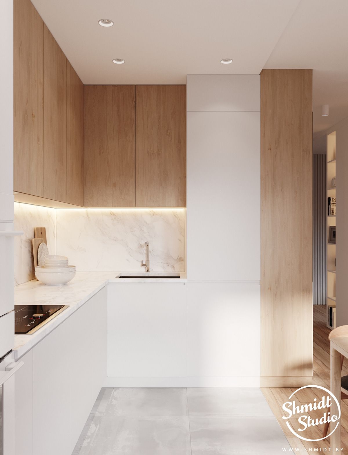 Cozinha compacta em L com gabinetes brancos e destaque para uma despenseira que se une aos armari...